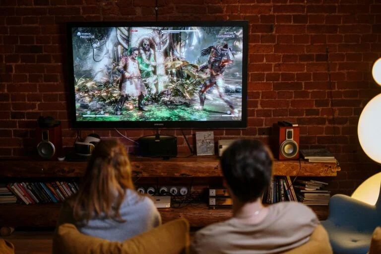two people watching tv